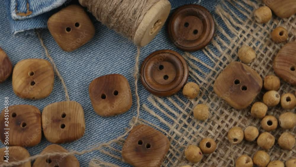 Accessories for sewing and needlework in style of eco fashion. Denim, wooden buttons, burlap and jute threads Accessories for sewing and needlework in style of eco fashion. Denim, wooden buttons, burlap and jute threads