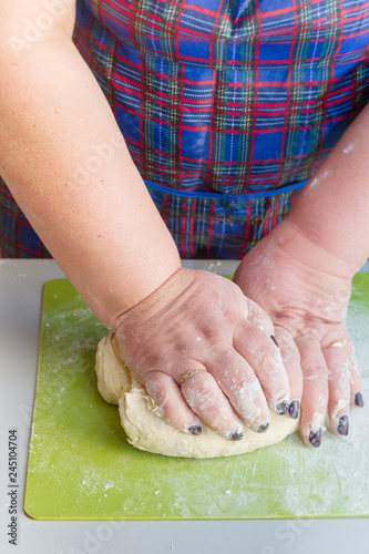 Knead the dough with your hands on the table