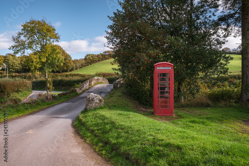 Stone bridge and a telephone booth in Malmsmead, Devon, England, UK photo
