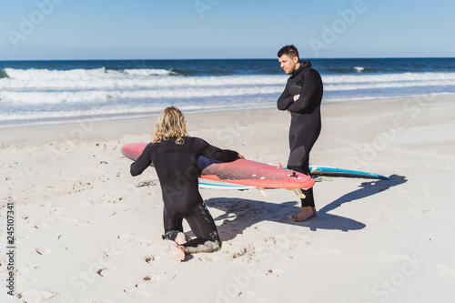 Canvas Print surf instructor with a student on the ocean