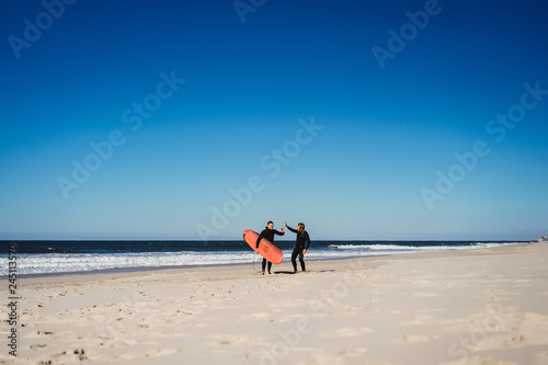 Photography surf instructor with a student on the ocean