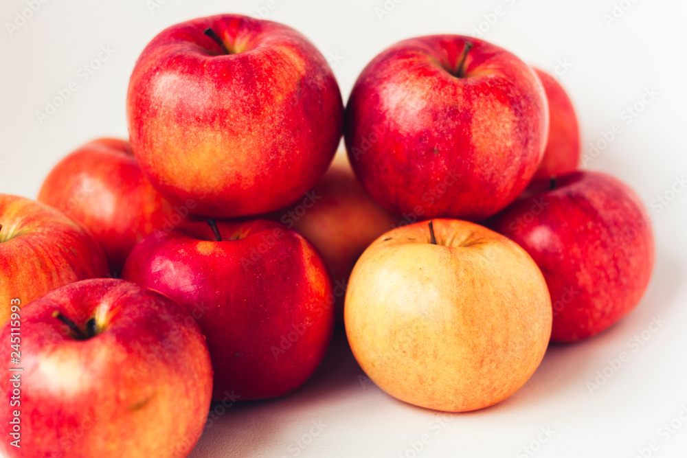 Fresh ripe red apples on white background, vegetarian concept. Fresh ripe red apples on white background, vegetarian concept.
