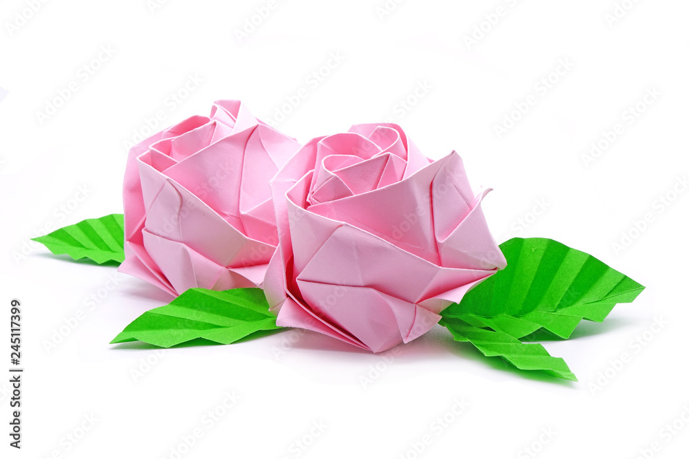 Rose : Origami pink roses with green leaf for love concepts of Valentine's day Holidays. Isolated on white background.