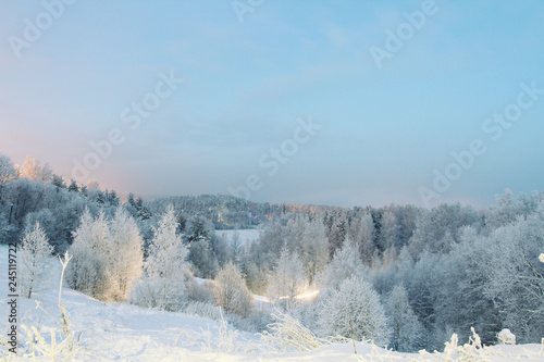 winter evening landscape, snow-covered panorama from the hills
