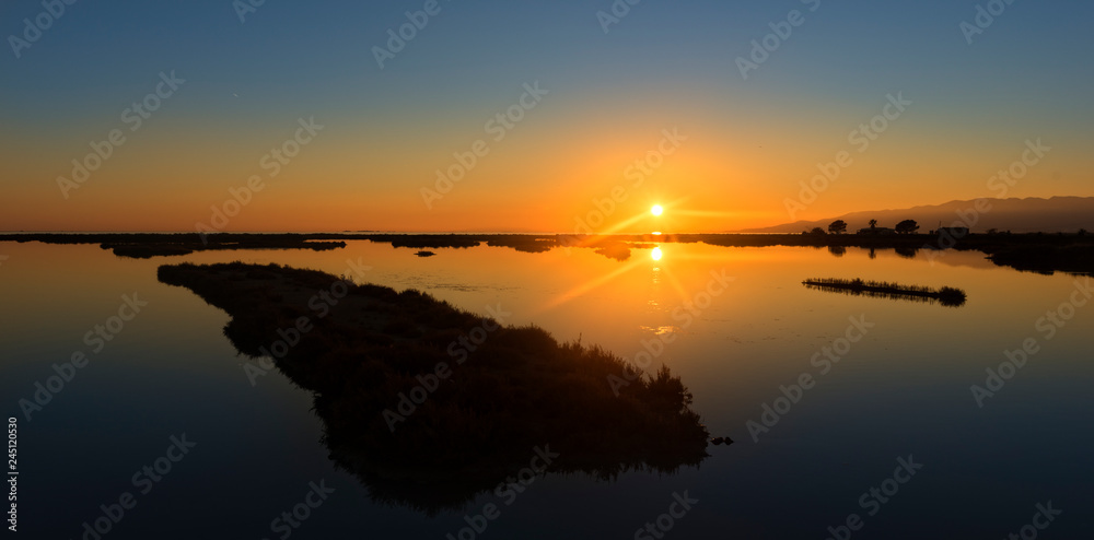 Panoramic of a sunset in the ebro delta by the sea Panoramic of a sunset in the ebro delta by the sea