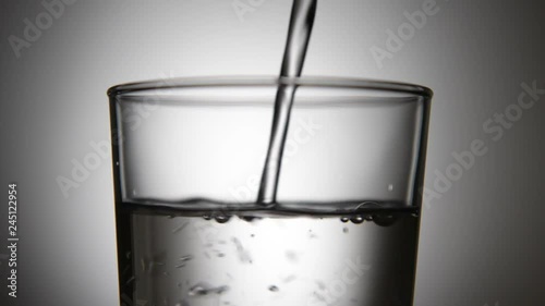 puoring water in to a glass photo