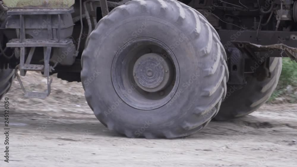 The excavator is driving. Big wheel close up. The excavator is driving. Big wheel close up.