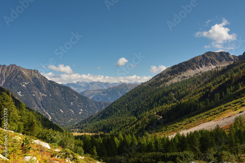 Landscape with Swiss alpine mountains with glaciers and sunset.