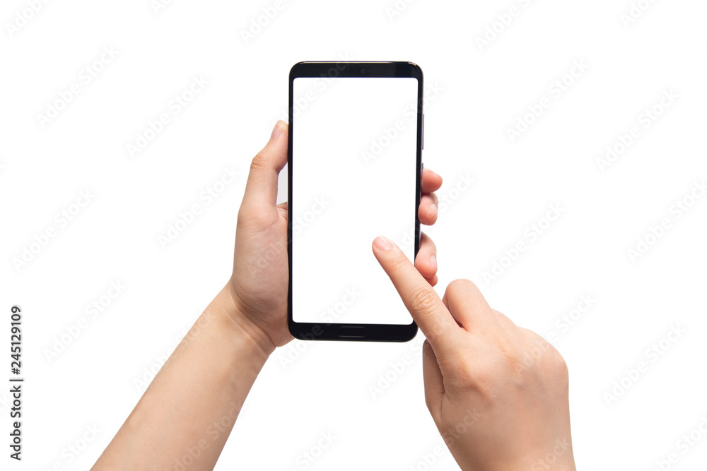 Close up of female hands holding and pointing mobile smart phone with white blank screen isolated on white background. Mock up. Copy space. Close up of female hands holding and pointing mobile smart phone with white blank screen isolated on white background. Mock up. Copy space.