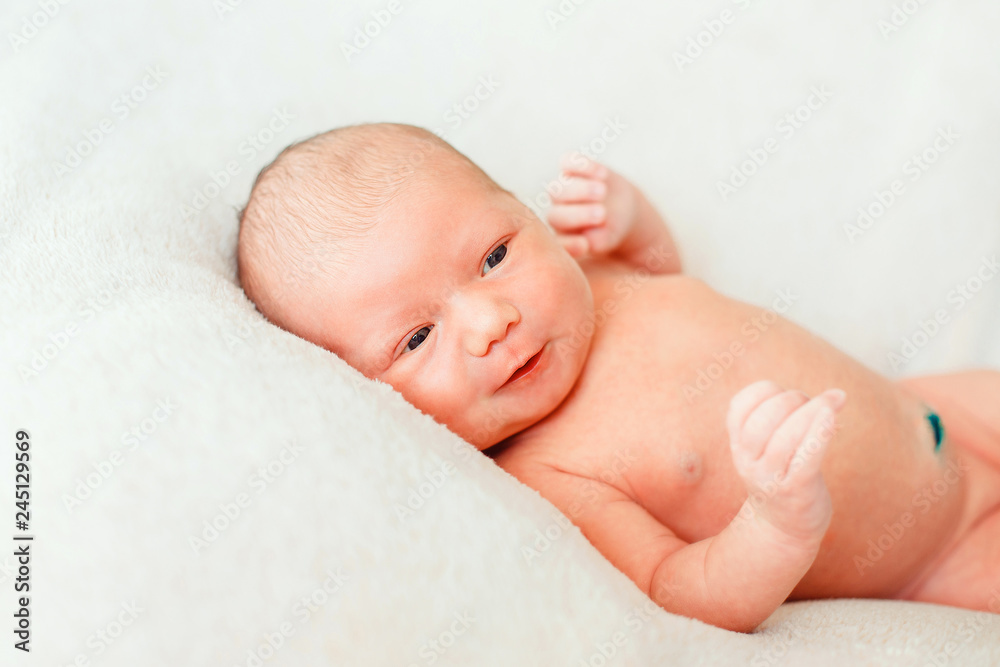 Newborn baby on a light background Newborn baby on a light background