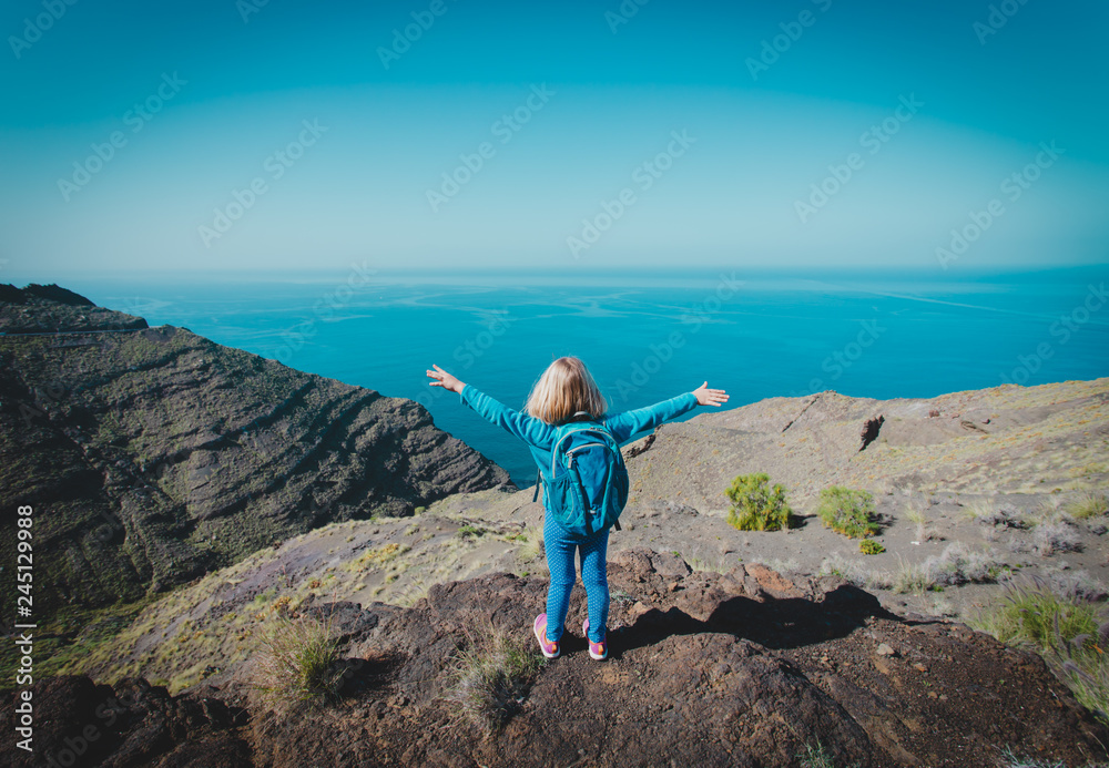 happy little girl enjoy travel in mountains