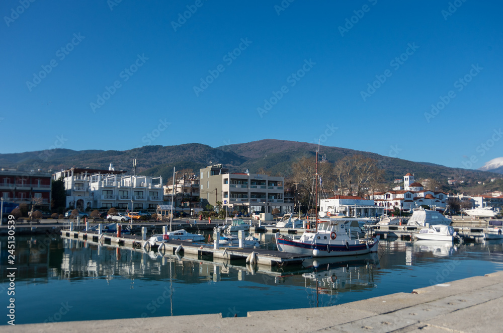 Harbor with boats and fishing schooners. Platamonas (Greek) is a sea-side resort and fishermans village in south Pireia, Central Macedonia.