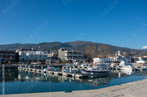  Harbor with boats and fishing schooners. Platamonas (Greek) is a sea-side resort and fishermans village in south Pireia, Central Macedonia. © smoke666