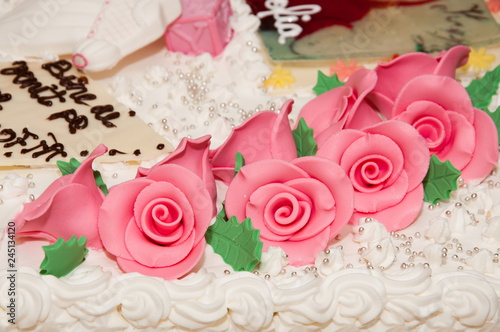  wedding cake at wedding reception.,pink rose