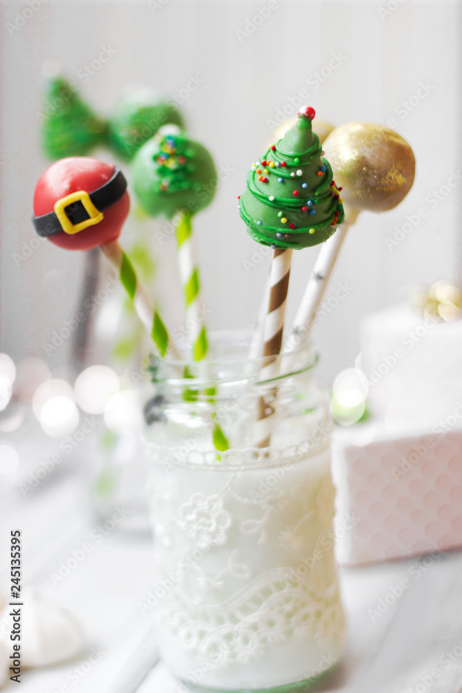 Fototapeta premium Christmas decorated cake pops; holiday background