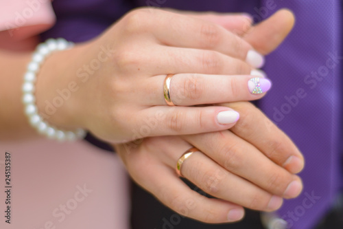 wedding: hands of newlyweds with rings close