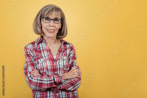 Portrait of a smiling old woman with glasses