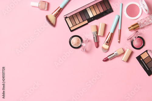 Fototapeta Naklejka Na Ścianę i Meble -   professional makeup tools. Makeup products on a colored background top view. A set of various products for makeup.