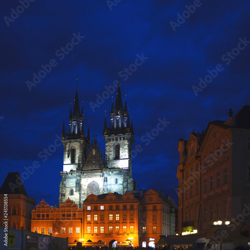 Two Gothic towers of the Church of our lady in the illumination late at night. Tyn Church