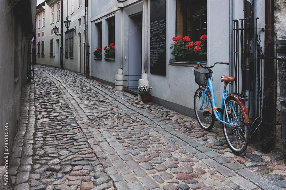 Bicycle is parked on the old street of Riga