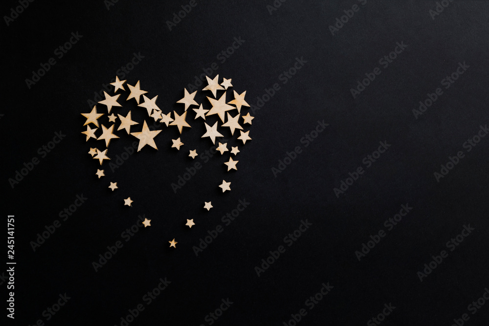 Heart of stars on a black background.