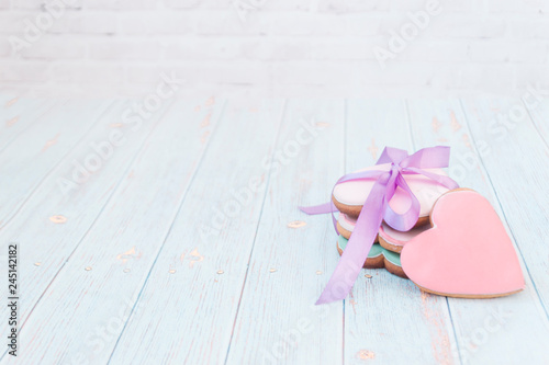 Pink gingerbread heart-shaped. Shabby chic style. On a light village background. photo