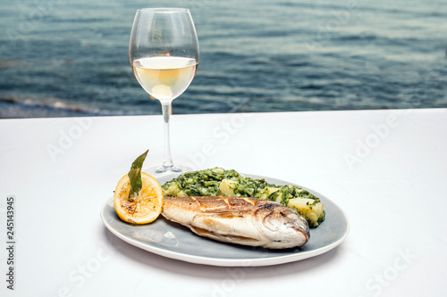 Fried fish on the background of the sea