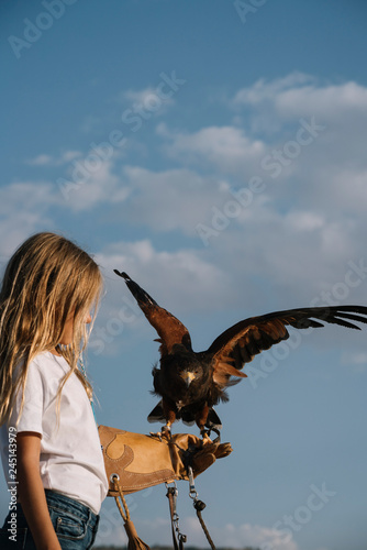 Little Girl with the bird rapacious in her hand