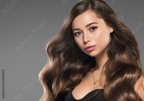 Beautiful long hair brunette woman with beauty hairstyle female model