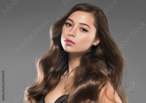 Beautiful long hair brunette woman with beauty hairstyle female model