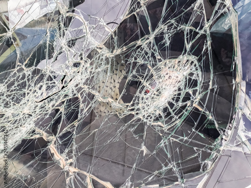 Car windshield shattered with stones by vandals.