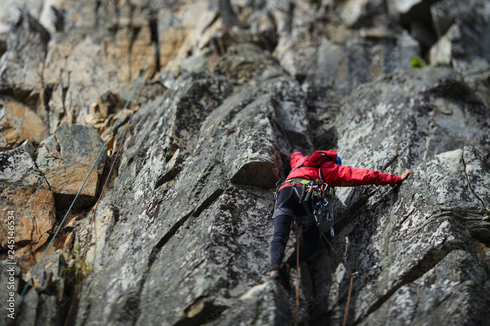 Rock climber climbs up the rocks. Tilt-Shift effect. Rock climber climbs up the rocks. Tilt-Shift effect.