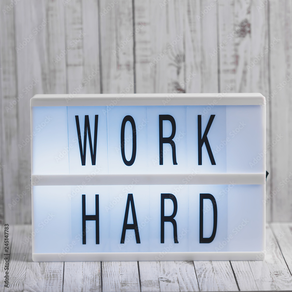 Obraz premium Lightbox with Powerful, Inspirational and Motivational Two Word Quote, Work Hard