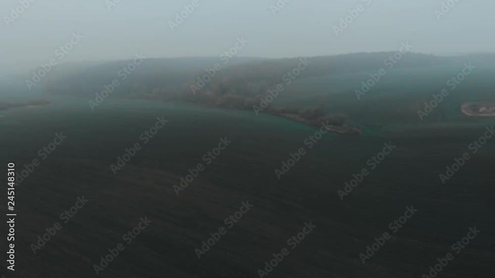 Aerial autumn fog above the road and field, flying drone, 4K cinematic color Aerial autumn fog above the road and field, flying drone, 4K cinematic color