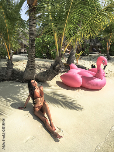 Fototapeta Sexy woman on tropical beach.