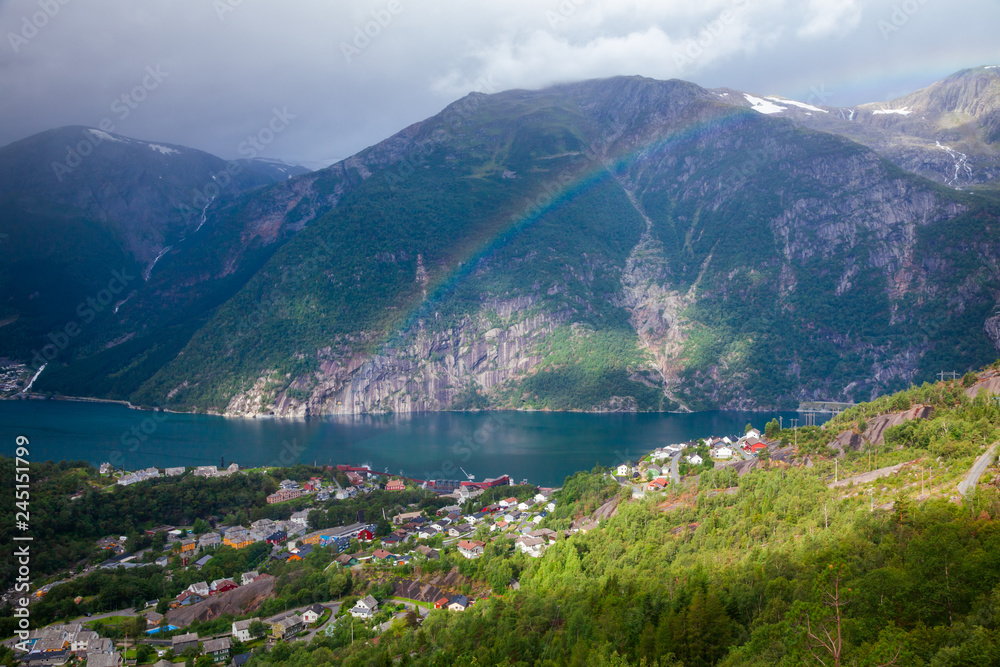 Rainbow over the Tyssedal town at Sorfjorden fjord Hordaland Norway Scandinavia