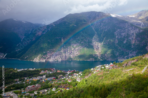 Rainbow over the Tyssedal town at Sorfjorden fjord Hordaland Norway Scandinavia