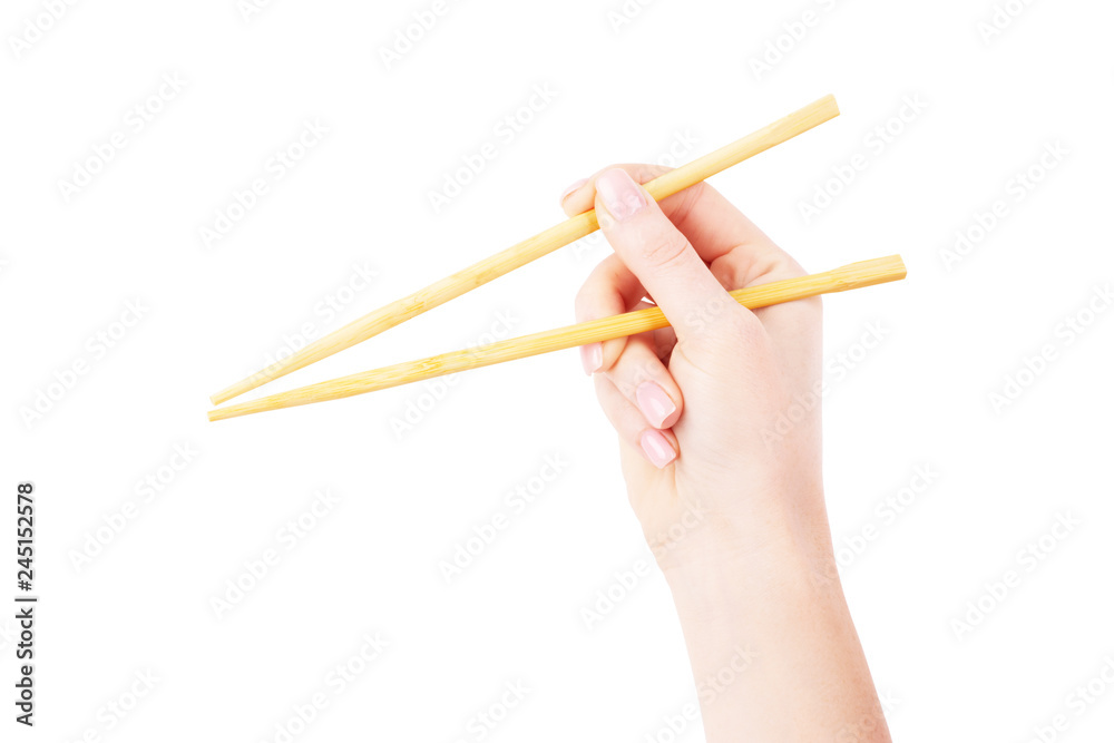 chopsticks in hand on a white background chopsticks in hand on a white background