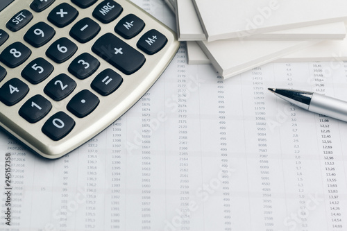 Business still life with calculator on table in office.