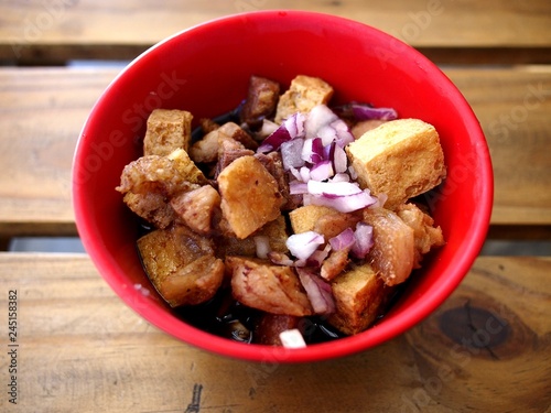 Bowl of chopped tofu and pork in soy sauce photo