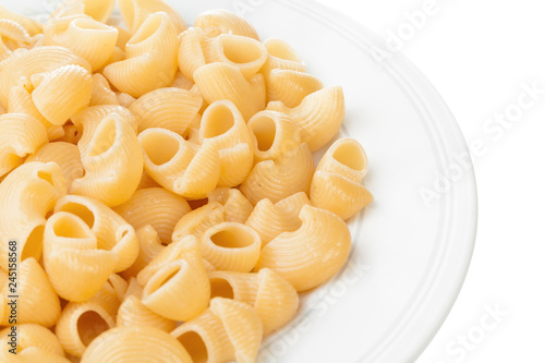 shell pasta in bowl, isolated on white background