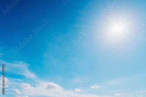 Fototapeta Naklejka Na Ścianę i Meble -  Blue sky with sun and clouds background.