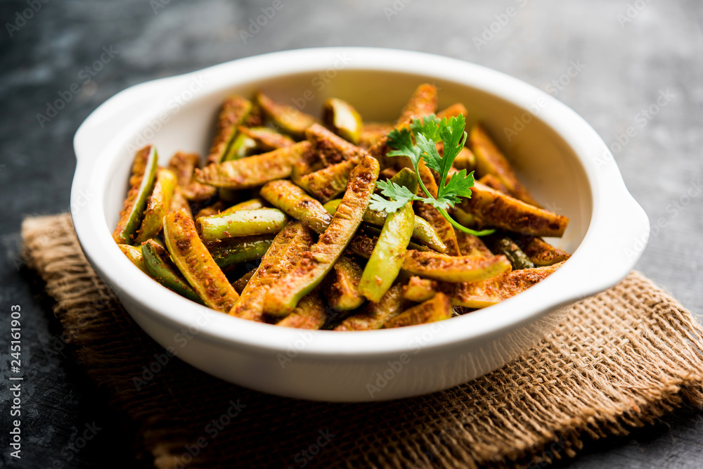 Tindora Sabzi / Tendli / tondli Fry also known as Ivy Gourd fry recipe. selective focus Tindora Sabzi / Tendli / tondli Fry also known as Ivy Gourd fry recipe. selective focus