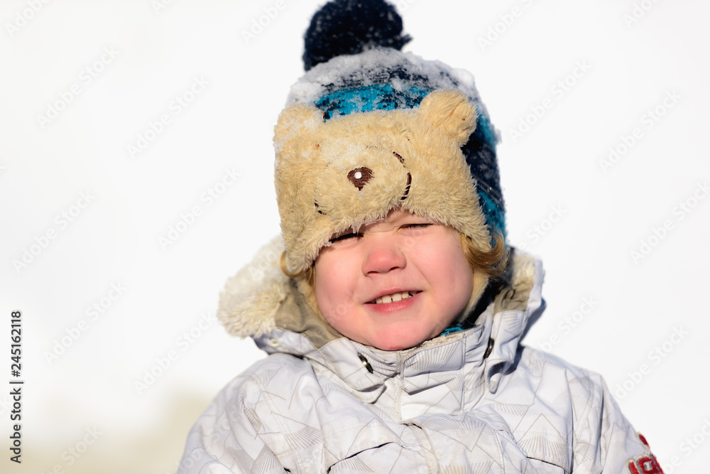 the kid plays in the winter snow the kid plays in the winter snow