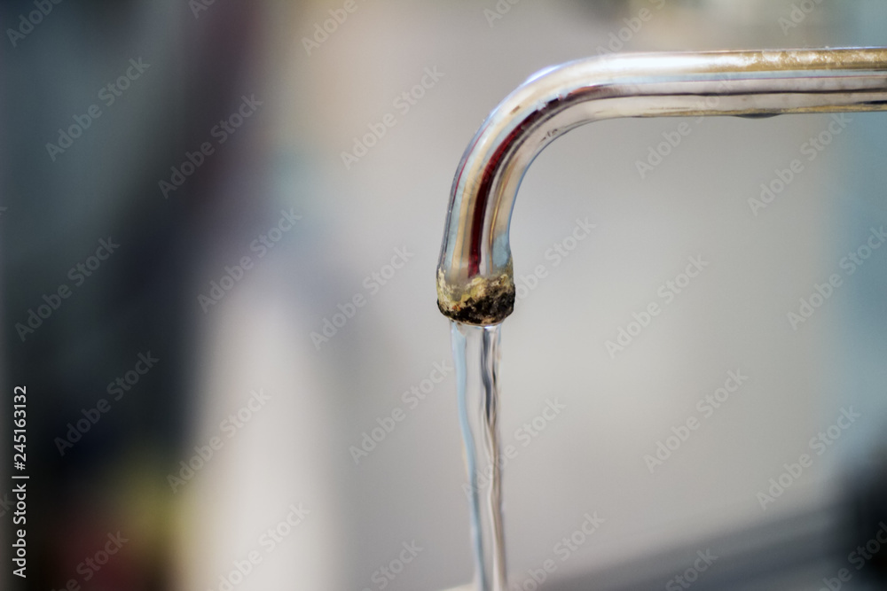 old faucet and water flow on bathroom old faucet and water flow on bathroom