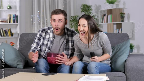 Frustrated friends suffering a blackout during tv sports match at home