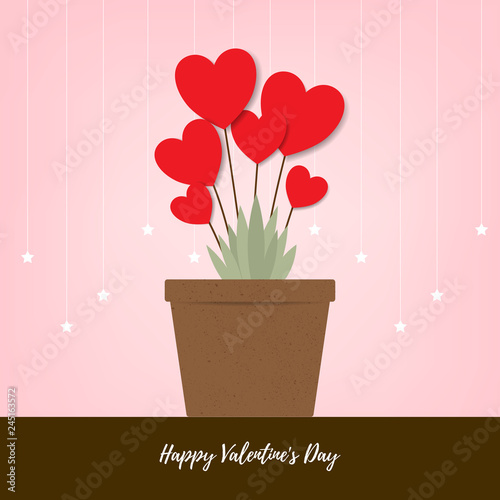 Red heart flowers in brown pot with pink background. Love valentine day concept.