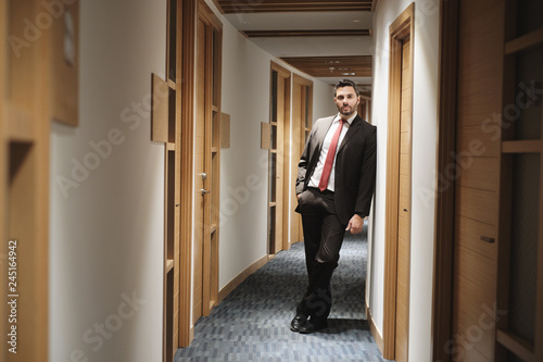 Portrait of Hispanic Businessman At Work As Manager In Office Corridor © Diego Cervo