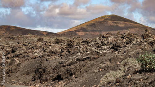 Volcano with lava fields in...