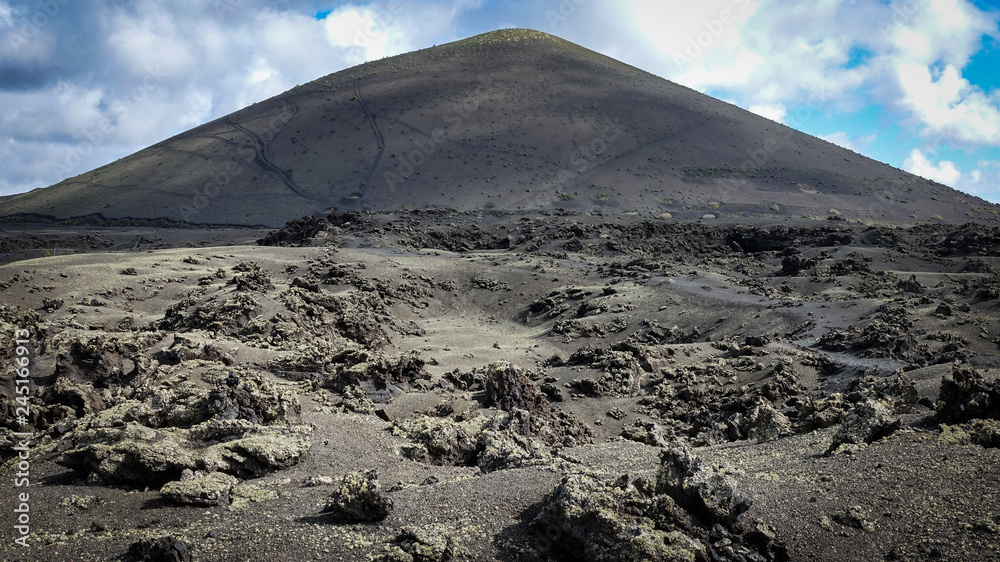Volcano with lava fields in the foreground. Lanzarote, Canary Islands.